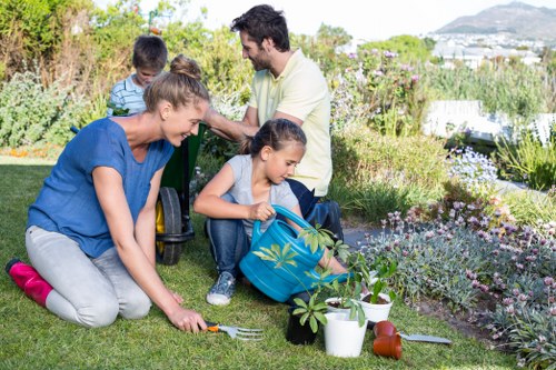 Professional North Harrow gardeners improving a tidy residential garden